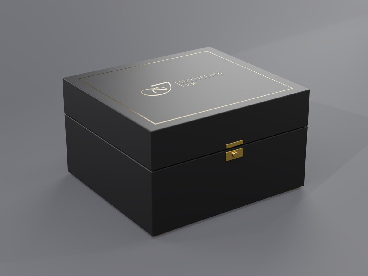 Closed matte black Intuitive EK presentation box with the gold engraved logo on the lid